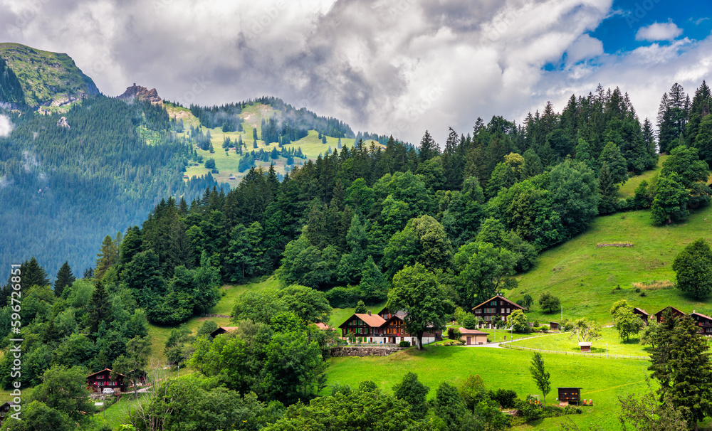 Townscape of village of Wengen on the edge of Lauterbrunnen Valley. Traditional local houses in Wengen village in the Interlaken district in the Bern canton of Switzerland.