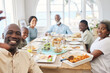 © Siphosethu Fanti/peopleimages.com - Family dinner best part of the day. Shot of a family taking a selfie while having lunch at home.