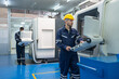 © Supachai - Male engineer operating cnc machine in control panel at factory. Man technician in uniform and helmet safety working at workshop heavy metal industrial