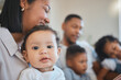 © Kirsten D/peopleimages.com - Whos the cutest you guessed it. Shot of a young family happily bonding together on the sofa at home.