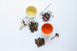© shine.graphics - Herbal leaf dried tea and cups with drink, top view on white background