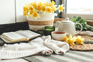 Wall Mural - Open Bible in a cozy home interior. Good morning