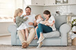 © Kirsten D/peopleimages.com - In time of test, family is best. Shot of a young family playing together on a sofa at home.