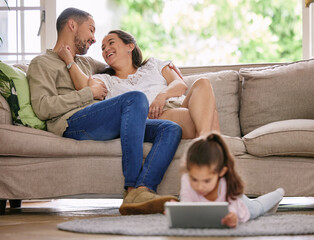 Sticker - This is what weve always wanted. Shot of a little girl using a digital tablet while relaxing at home.