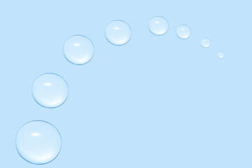 Wall Mural - Drops of transparent gel or water in the shape of a semi-circle, with decreasing size. On a blue background.