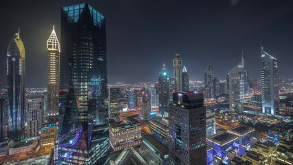 Poster - Panorama of futuristic skyscrapers in financial district business center in Dubai night timelapse