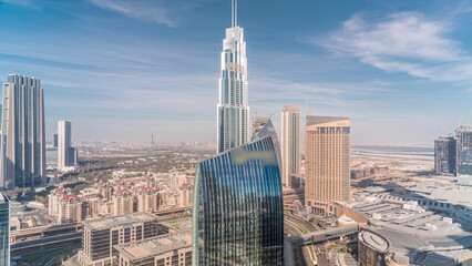 Wall Mural - Aerial panorama of Downtown Dubai with shopping mall and traffic on a street all day timelapse from above, UAE