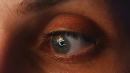 Eye extreme close up , vision and reading website woman with screen reflection for e commerce, digital or data cloud. Focus of email or media with eyeball movement for mission, internet or online web