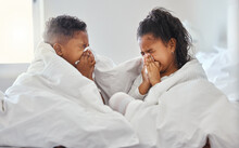 Tis The Season To Be Snotty. Shot Of A Brother And Sister Blowing Their Nose In Bed.