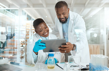 Wall Mural - dive into our world of science. shot of two scientists using a digital tablet in a laboratory.