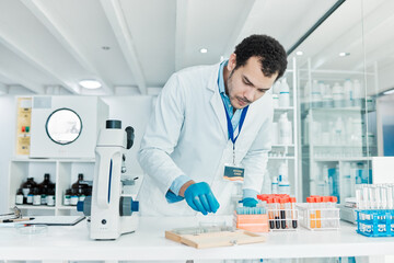 Wall Mural - i have to perfect this cure. shot of a young scientist working with samples in a lab.