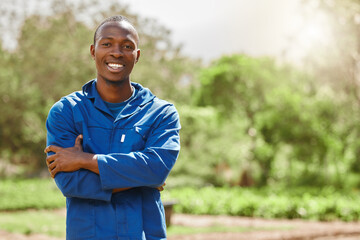 Wall Mural - Everything is fresh on this farm. Cropped portrait of a handsome young male farm worker tending to the crops.