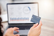 © Clayton Daniels/peopleimages.com - First we pay bills. Shot of an unrecognizable businessperson using a credit card and laptop at work.