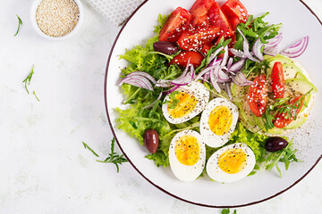 Wall Mural - Fresh  salad with tomato, olives, boiled eggs and and sandwich with  ricotta cheese, avocado. Top view, flat lay