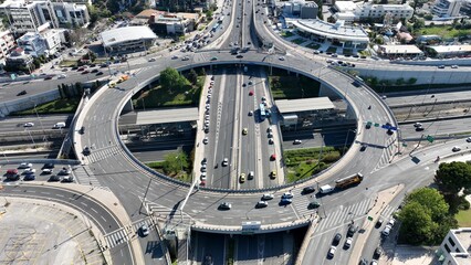 Wall Mural - Aerial drone photo of multilevel circular ring road junction passing through urban city centre connecting National motorway and popular avenue
