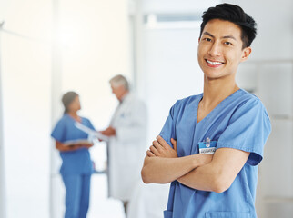 Canvas Print - Providing quality care to your treatment as a patient. Portrait of a young doctor standing with his arms crossed in a hospital.