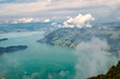 Panoramic summer landscape over Lake Lucerne, Lake Zug and Swiss Alps from Rigi-Kulm viewpoint summit of Mount Rigi. Alpine scenery toward mountain peaks in Canton of Lucerne, Central Switzerland.