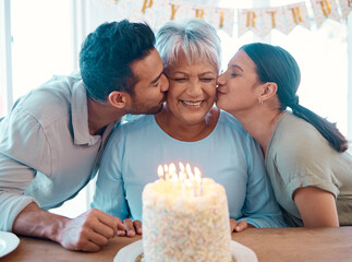 Wall Mural - We love you. Shot of two young adults celebrating a birthday with a mature woman at home.