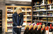man choosing a wine, champagne at supermarket.