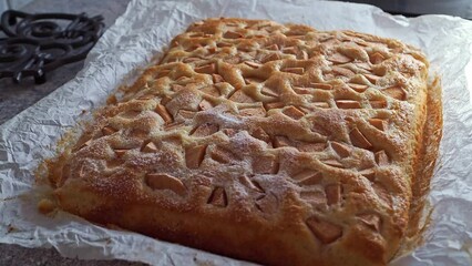 Wall Mural - Sweet cake with pear pieces sprinkled with sugar on baking paper