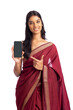 Indian young woman in saree with cellphone, smartphone business concept isolated on white.  