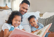 © Kirsten D/peopleimages.com - Everyone gets a turn to read. Shot of a young man reading to his kids on the sofa at home.