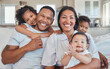 © Kirsten D/peopleimages.com - Just chilling. Shot of a young family happily bonding together on the sofa at home.