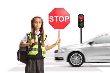 Sticker - Schoolgirl holding a stop sign in front of a car and traffic lights