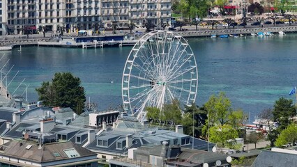 Wall Mural - City of Geneva with Ferris Wheel from above on a sunny day - aerial view by drone