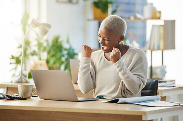 Poster - Good news can make anyones day. Shot of a young businesswoman cheering in excitement at her desk.