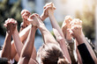 © Clayton Daniels/peopleimages.com - Uniting for a cause. Shot of a group of protestors with their fists raised.
