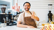 © IC Production - Happy coffee shop owner raised his thumb up