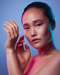 Poster - Ill knock your lights out, blow a fuze. Cropped shot of an attractive young woman posing in studio against a purple background.