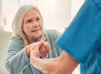 Poster - It is the courage to continue that counts. Shot of a young nurse helping her elderly female patient stand up.