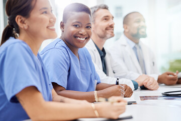 Poster - Showcasing effective multidisciplinary collaboration. Shot of a doctor sitting alongside his colleagues during a meeting in a hospital boardroom.