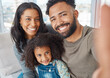 © Nina L/peopleimages.com - We start and end with the family. Shot of a family taking a selfie at home.