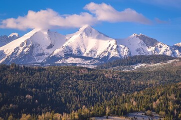 Wall Mural - Beautiful morning spring landscape in the countryside. View of the Belianske Tatras from the village of Osturna in Slovakia.