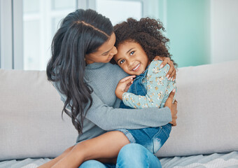 Canvas Print - You dont choose your family. Shot of a mother and her little daughter relaxing together at home.