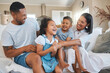 © Kirsten D/peopleimages.com - Mom turns into a tickle monster. Shot of a young family happily bonding together on the sofa at home.