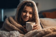 young girl teen teenager woman snuggled up in a blanket at home while relaxing or recovering from an illness or flu or virus. Generative AI