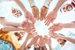 © Davide Angelini - Group of young people stacking hands outdoors - Teamwork concept with guys and girls support each other - College students standing together outside