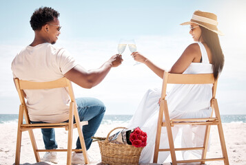 Wall Mural - To us. Shot of a young couple celebrating their engagement at the beach.