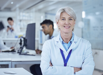 Wall Mural - she dominates her field. shot of a proud mature female scientist in the lab.