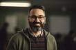 © Hanne Bauer - Portrait of a handsome man with a beard and glasses in the office