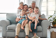 © Kirsten D/peopleimages.com - Live your life with love. Shot of a happy family relaxing on the sofa at home.