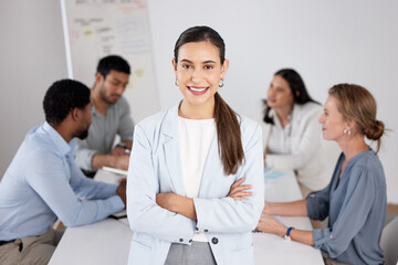 Poster - This team fills me with confidence. Cropped portrait of an attractive young businesswoman standing with her arms folded in the boardroom and her colleagues in the background.