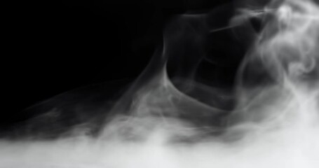 Wall Mural - rolling smoke clouds or swirling fog with wisps of vapor on black.