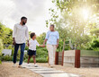 © Irshaad Majal/peopleimages.com - Were sure going to have a lovely day together. Shot of a happy family taking a walk together outdoors.