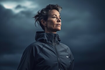 Portrait of a woman in a raincoat on a stormy day