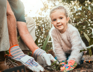 Sticker - The love of gardening. Shot of an adorable little girl gardening with her grandfather.